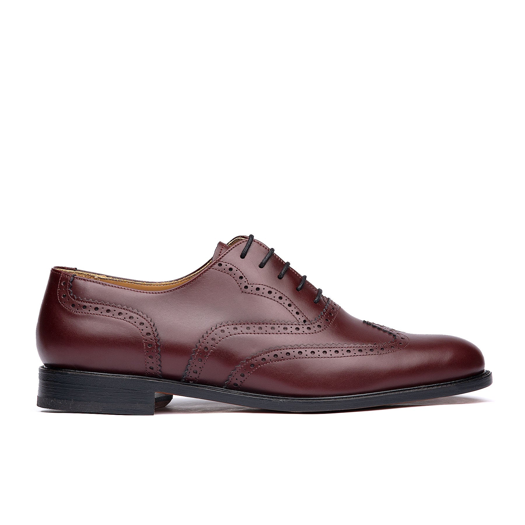 Burgundy wingtip shoes with leather sole and brogues for both casual and formal wear