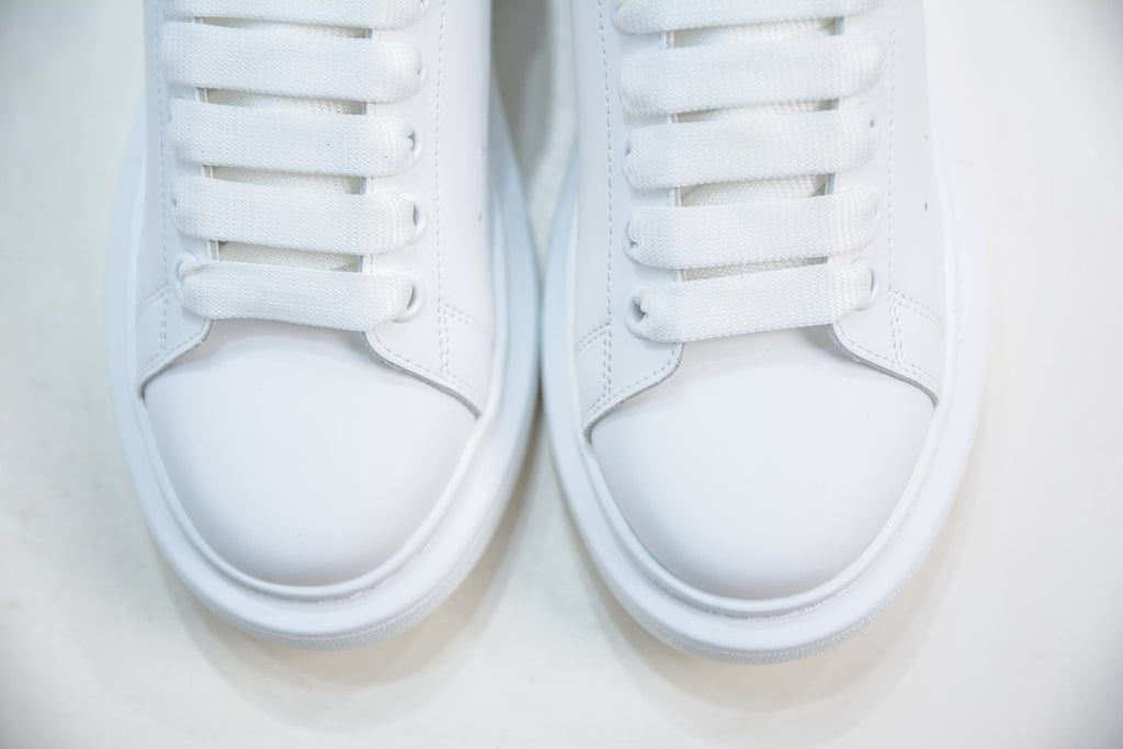 ** Alexander McQueen White Sneakers with Black Suede Detail

**