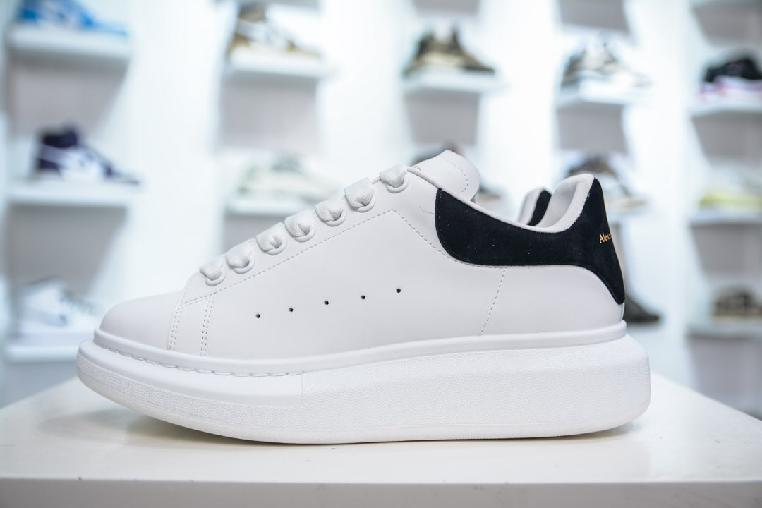 ** Alexander McQueen White Sneakers with Black Suede Detail

**