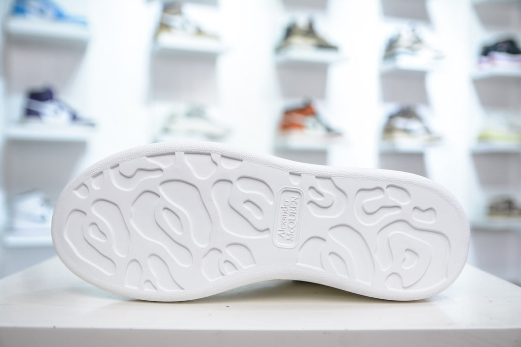 ** Alexander McQueen White Sneakers with Black Suede Detail

**