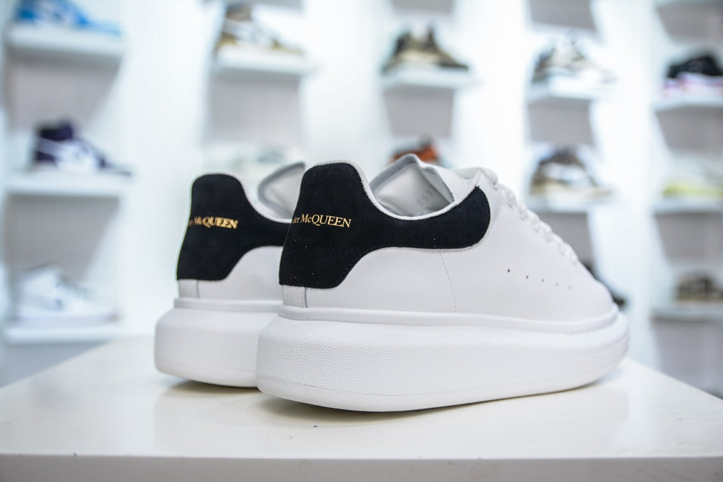 ** Alexander McQueen White Sneakers with Black Suede Detail

**