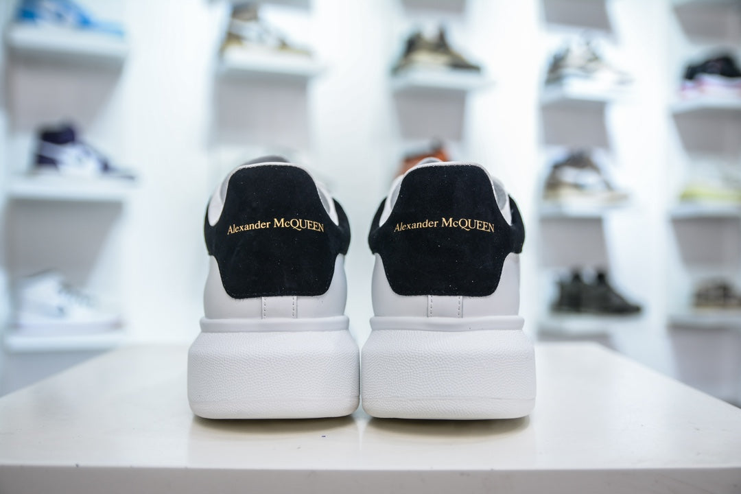 ** Alexander McQueen White Sneakers with Black Suede Detail

**