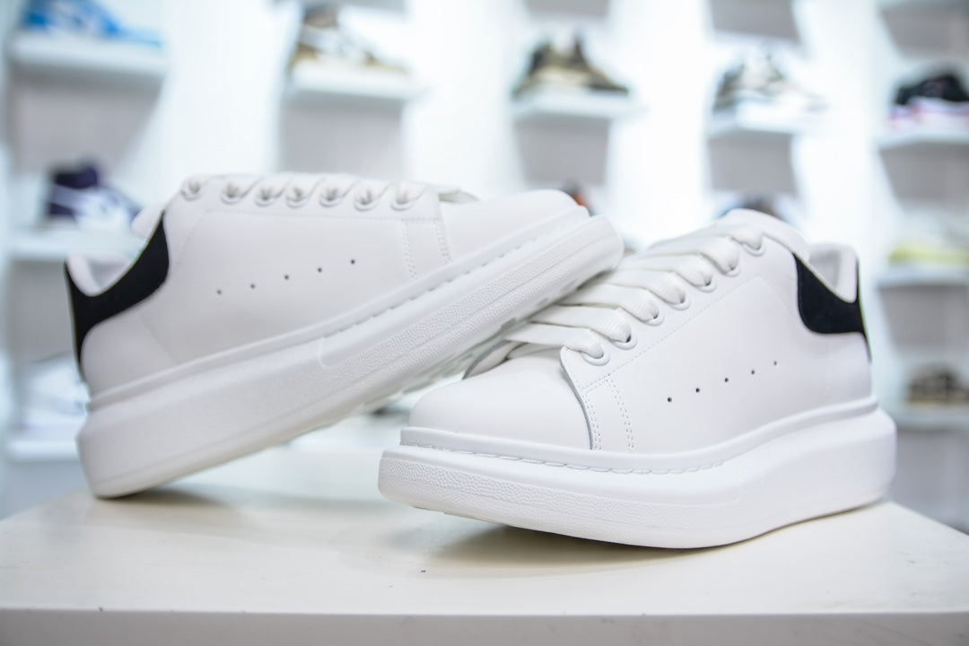 ** Alexander McQueen White Sneakers with Black Suede Detail

**