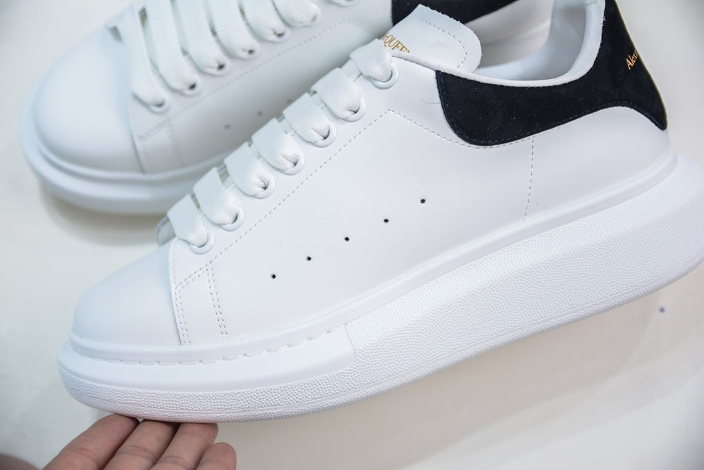 ** Alexander McQueen White Sneakers with Black Suede Detail

**
