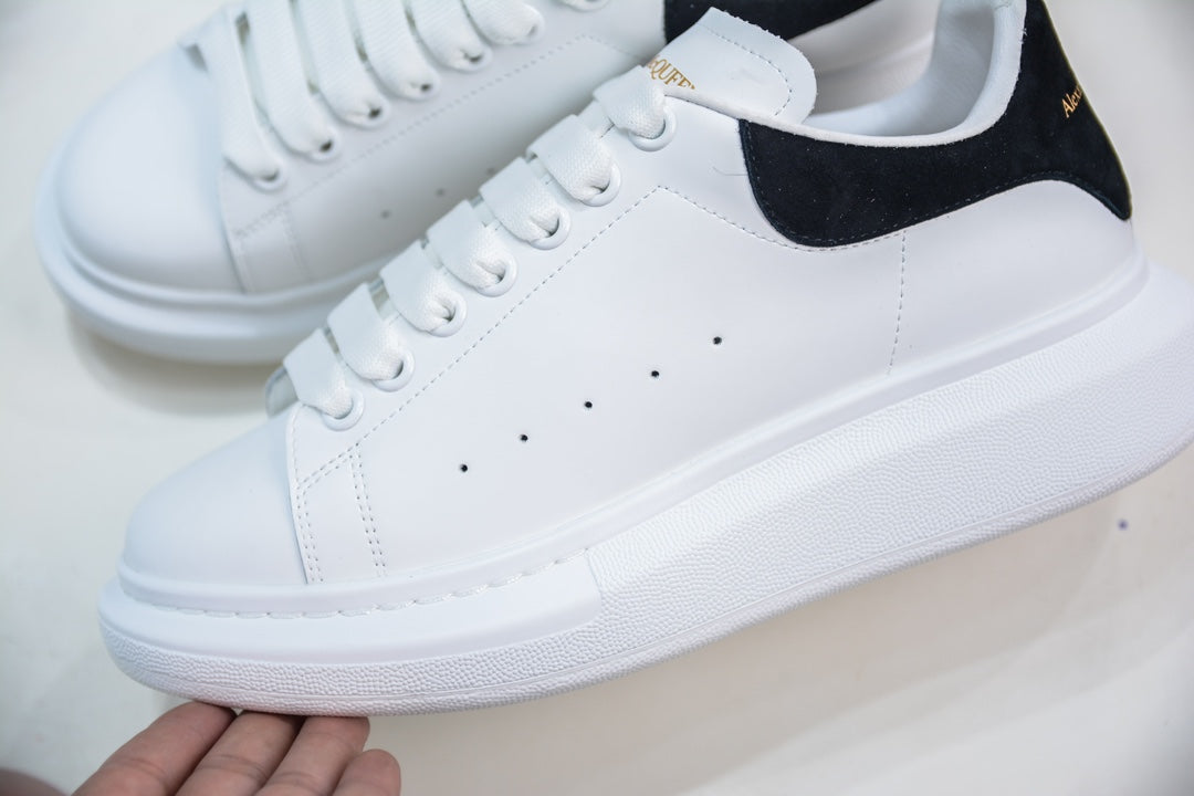 ** Alexander McQueen White Sneakers with Black Suede Detail

**