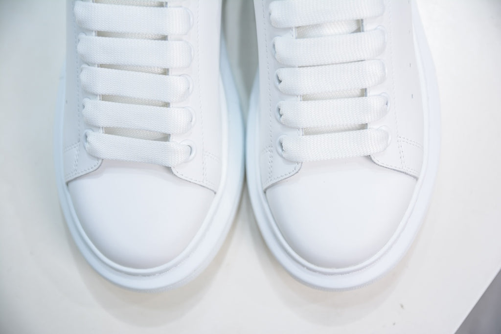 ** Alexander McQueen White Sneakers with Black Suede Detail

**