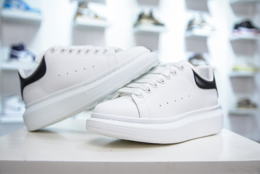** Alexander McQueen White Sneakers with Black Suede Detail

**