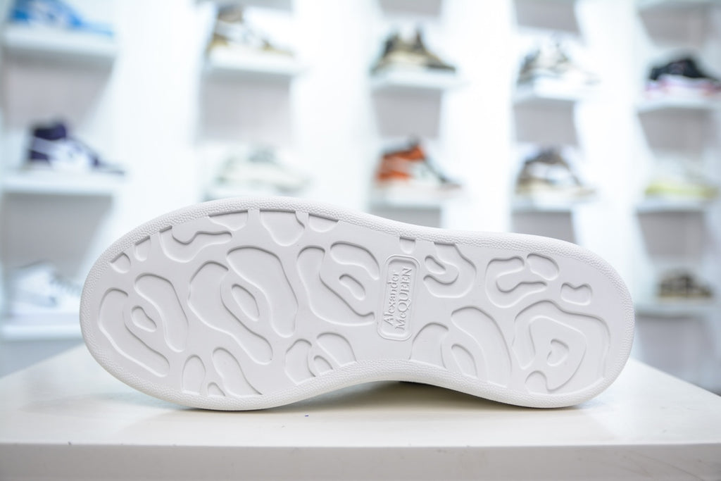 ** Alexander McQueen White Sneakers with Black Suede Detail

**