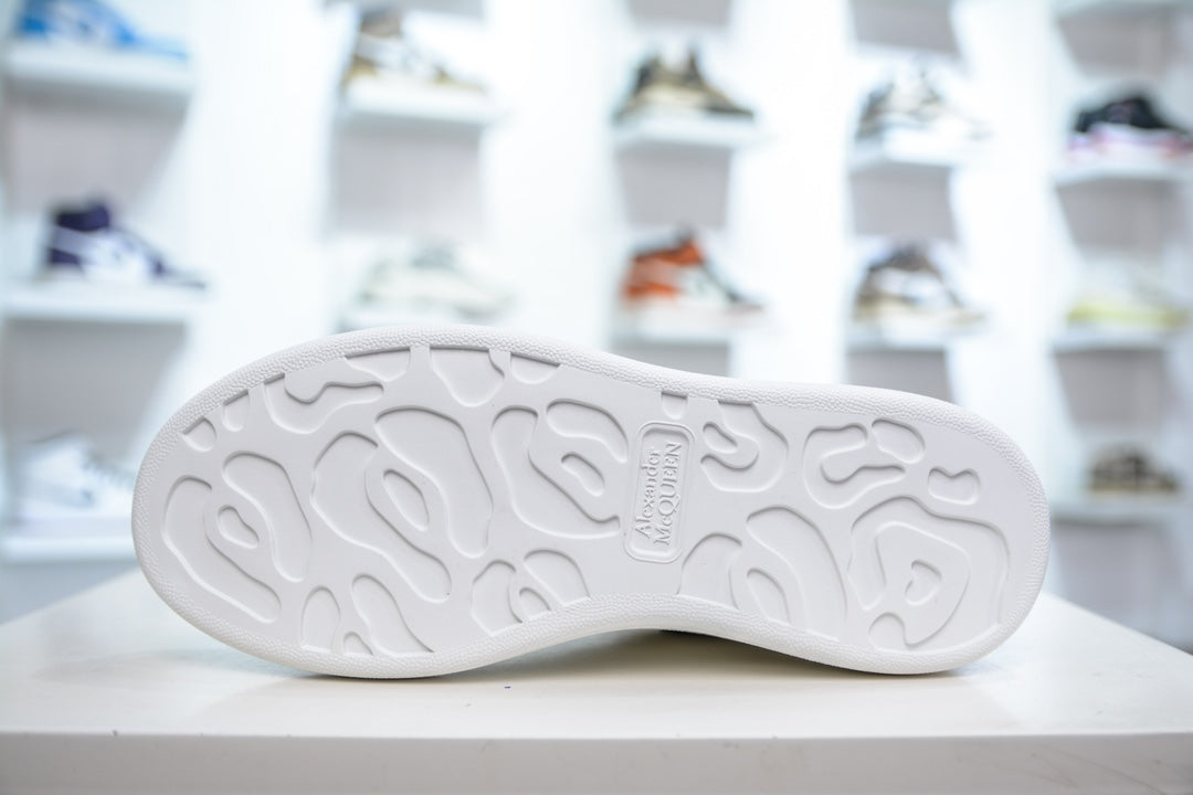 ** Alexander McQueen White Sneakers with Black Suede Detail

**