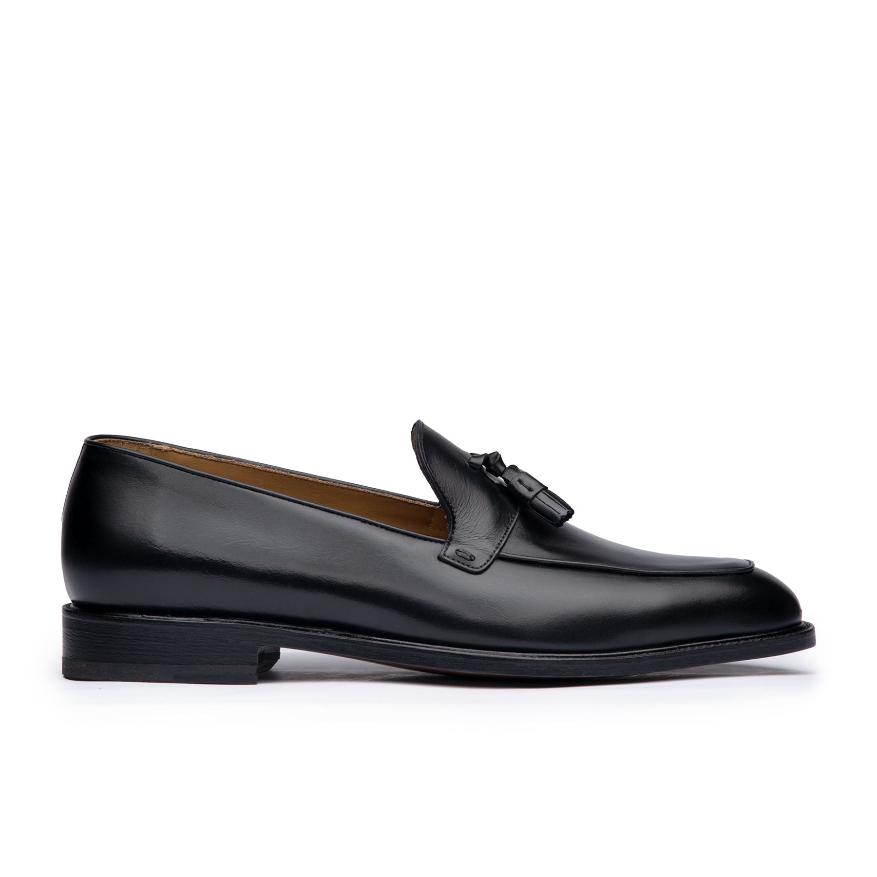 Mens tassel loafers in black full grain calfskin leather with suede finish at the heel cap