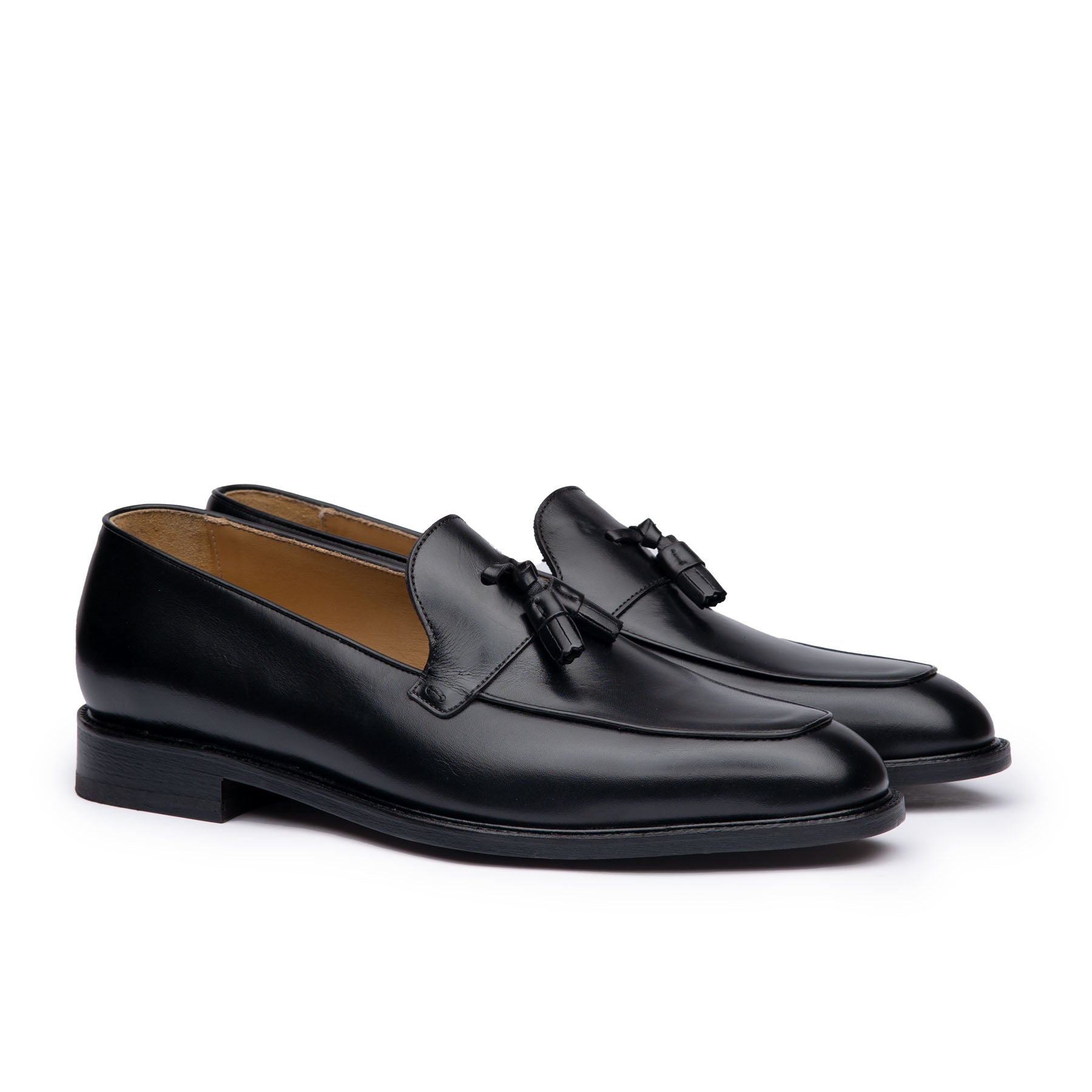 Mens tassel loafers in black full grain calfskin leather with suede finish at the heel cap